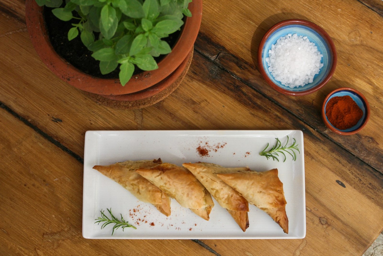 Join Thomai, a celebrated gastronomic specialist, for a unique day-long experience filled with hands-on cooking lessons, uncovering the secrets of authentic Greek culinary traditions in a majestic backdrop of the Aegean Sea.